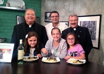 Monsignor Jim Vlaun, Rudy Gambino, Father Michael Vetrano and friends at La Parmigiana in Southampton