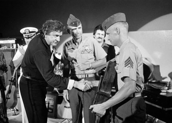 Johnny Cash receives an award from a Marine sergeant