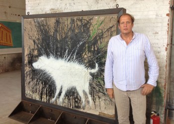 Stephan Kezsler with Wet Dog by Banksy