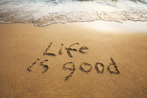 Life Is Good on beach sand