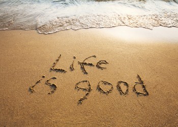Life Is Good on beach sand