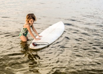 Little girl with surfboard