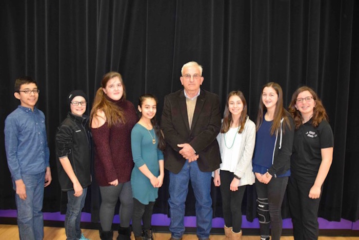 The Hampton Bays School District honored Mr. Frederick Dacierno for his service at a ceremony March 17. He is pictured with Hampton Middle School eighth-grade representatives.