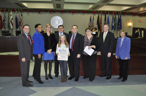 Brookhaven Town Councilman Dan Panico honors Kayla Mitchell, a Center Moriches resident and "Master Chef Junior" contestant.