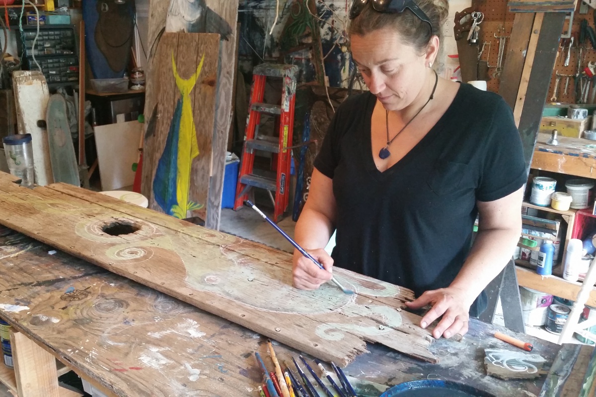 Artist Carolyn Munaco at work in her home studio in Hampton Bays.