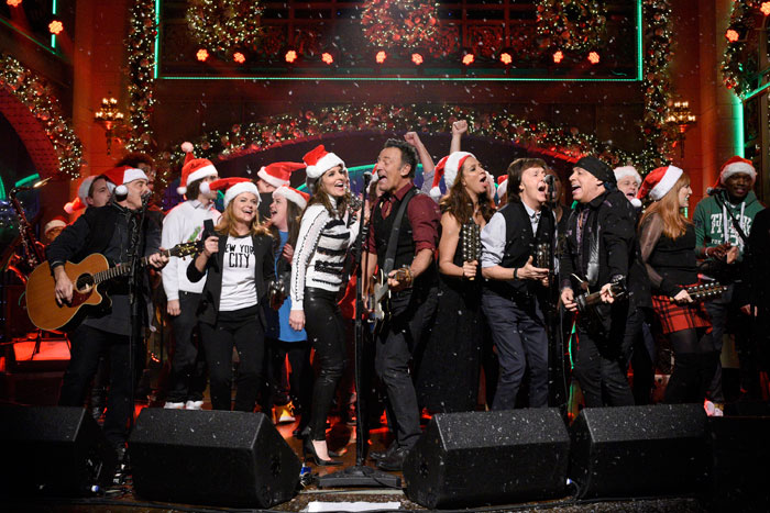 Musical guest Bruce Springsteen performs with Amy Poehler, Tina Fey, Maya Rudolph, and Paul McCartney on the Saturday Night LiveDecember 19, 2015, episode.