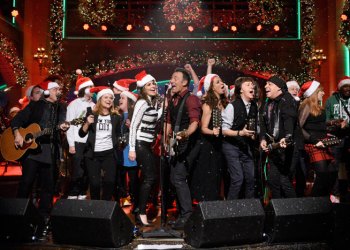 Musical guest Bruce Springsteen performs with Amy Poehler, Tina Fey, Maya Rudolph, and Paul McCartney on the Saturday Night LiveDecember 19, 2015, episode.
