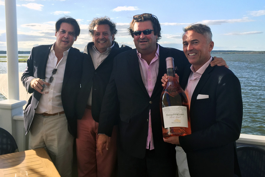 Chateau D’Esclans winemaker Sacha Lichine (second from right) and Ambassador Paul Chevalier (far right) celebrate the launch of Rock Angel rose at Dockers in East Quogue