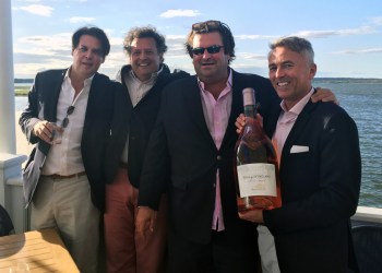 Chateau D’Esclans winemaker Sacha Lichine (second from right) and Ambassador Paul Chevalier (far right) celebrate the launch of Rock Angel rose at Dockers in East Quogue