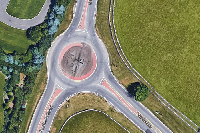 Google Maps satellite view of Scuttle Hole Road traffic circle