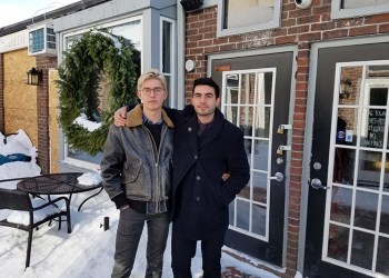 Sag Harbor couple Adrian Stivala and Roman Krugovykh in front of the shuttered SagTown Coffee