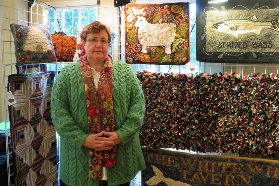 Sarah McNamara with her fiber works at Remsenburg Academy