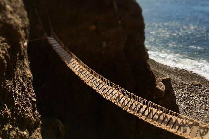 Scott Bluedorn "Bridge I", wood veneer and yarn, 9', 2016. Installation view 40 feet above the sea