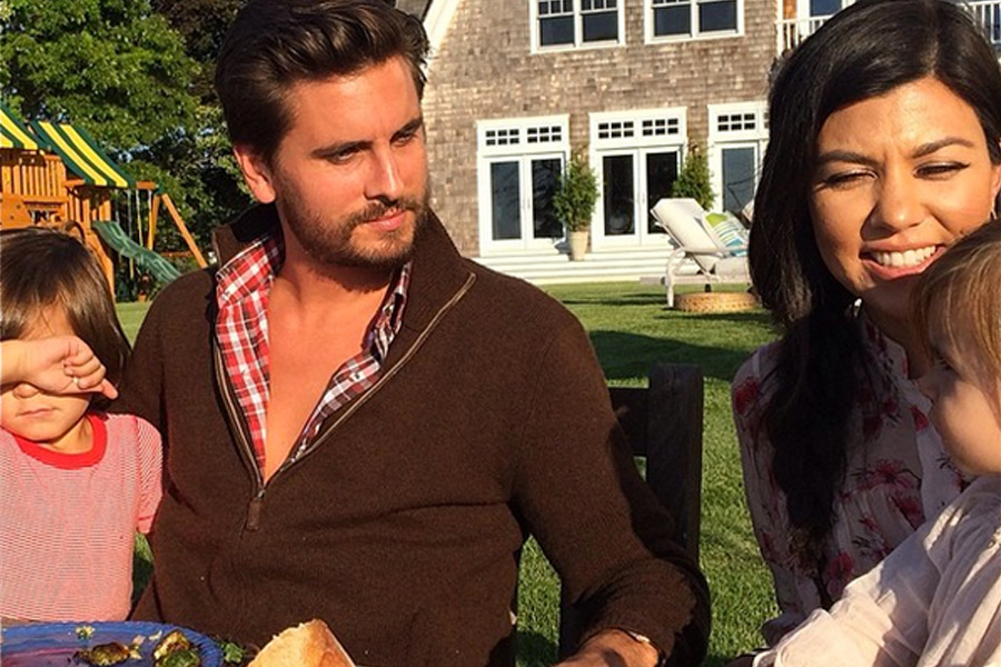 Scott Disick and Kourtney Kardashian and their kids enjoy a meal outside in the Hamptons