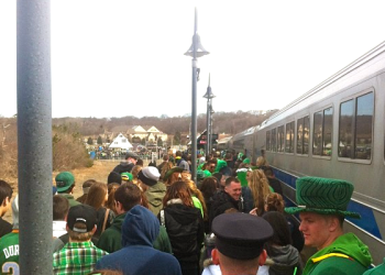 Parade revelers arrive on Montauk on the Long Island Rail Road.