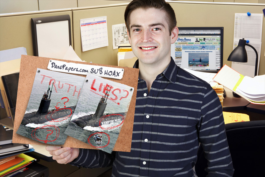 Landon Jones shows off his research materials about the Hamptons Police Department submarine