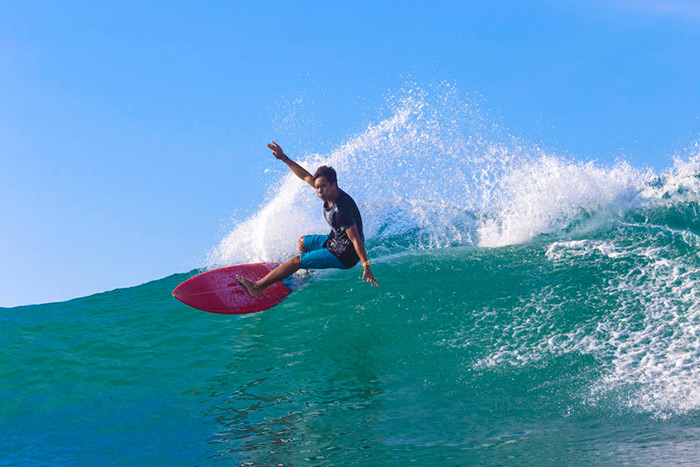 surfer carving wave