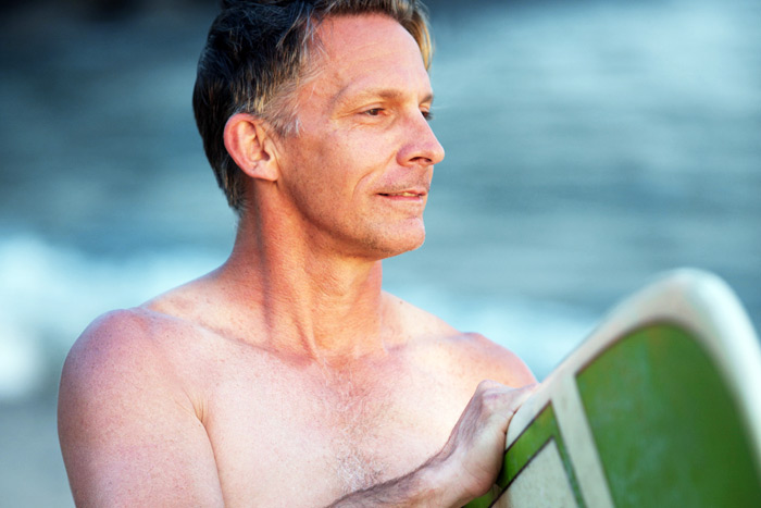 Surfer with green board