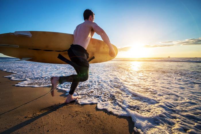 Surfer hits the waves