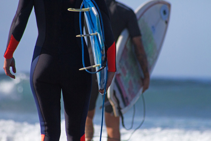 Surfer in wetsuit fullsuit