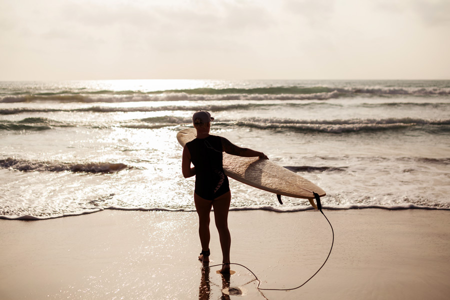 surfer prepares to hit the waves - from Hamptons Surf Report