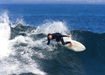 Surfer shredding wave