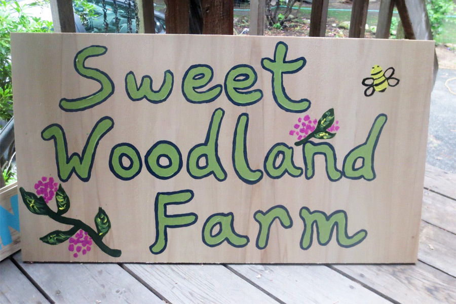 Sweet Woodland Farm sign