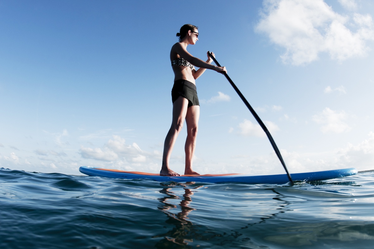 Get out in the sun—try stand-up paddleboarding this summer.