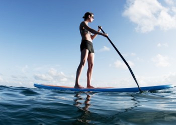 Get out in the sun—try stand-up paddleboarding this summer.