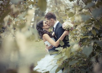 Married Couple embracing in the park