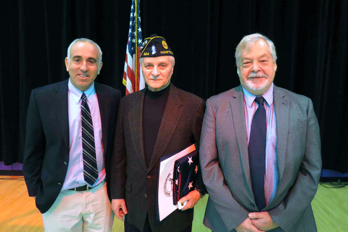 Hampton Bays Korean War Veteran Herbert Jannsen (center) was honored by the Hampton Bays School District at a ceremony on Jan. 22. Also pictured are Southampton Supervisor Jay Schneiderman and Southampton Councilman John Bouvier.