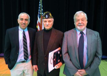Hampton Bays Korean War Veteran Herbert Jannsen (center) was honored by the Hampton Bays School District at a ceremony on Jan. 22. Also pictured are Southampton Supervisor Jay Schneiderman and Southampton Councilman John Bouvier.