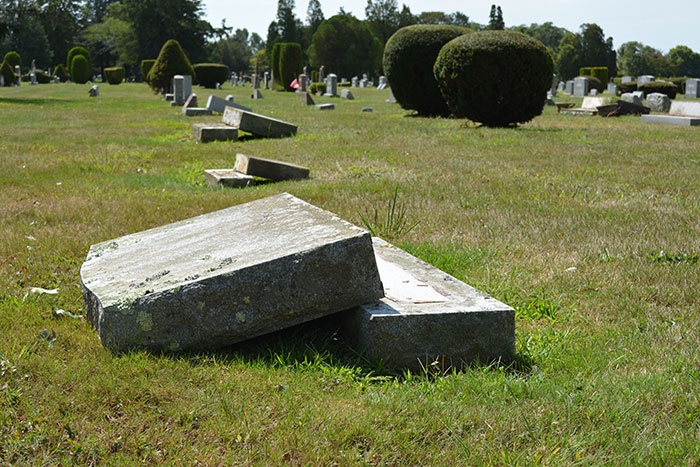 vandalized grave markers at Sacred Hearts cemetery in Southampton