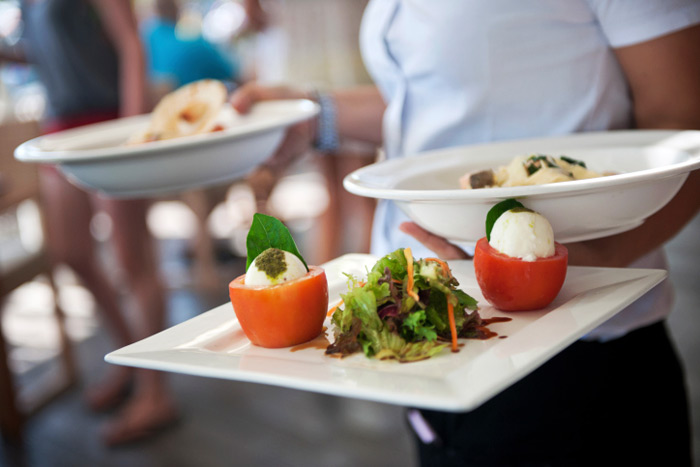 Waitress serving at restaurant
