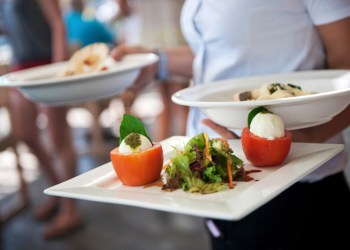 Waitress serving at restaurant