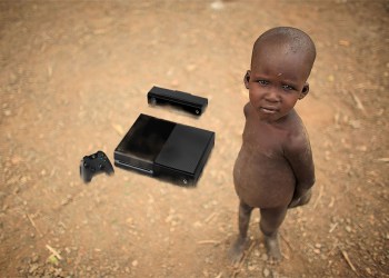 Boy from Northern Kenya's Turkana tribe with his new Xbox One console