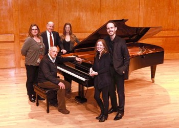 The Stony Brook Music Department faculty and students surround a Bosendorfer Imperial Grand Piano, donated by the Billy Joel Foundation. From back to front are: Christina Dahl, Associate Professor of Piano; Perry Goldstein, Chair, Department of Music; Elizabeth Dorman, Piano Master’s Student; Gilbert Kalish, Distinguished Professor, Piano; Annie Brooks, Piano Masters Student; and David Brooks, (DMA).
