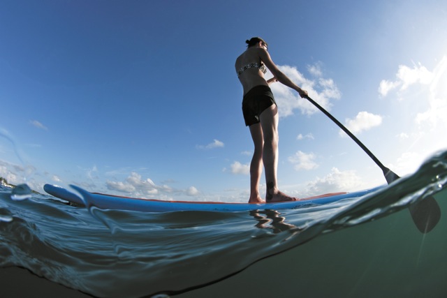Stand up paddleboarding is a fun fall activity on the water.