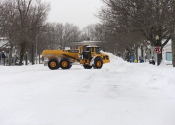 Snow cleanup on Main Street in Southampton Village Tuesday.