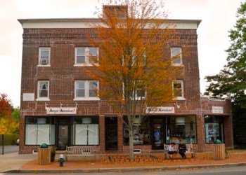 Built in 1923 by Albert Cavagnaro, the grandfather of the seller John Cavagnaro, the commercial building located at 105-107 Newtown Lane includes three retail stores; eight one-bedroom/one-bath apartments; a detached four-car garage; and a separate one-family house.