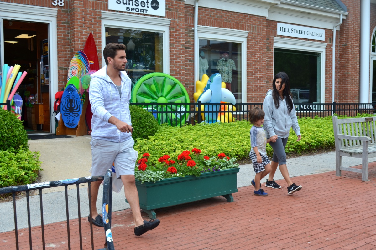 Scott Disick, Kourtney Kardashian and their son, Mason Disick, leave Sunrise to Sunset Surf + Sport on Hill Street in Southampton Village. the hamptons