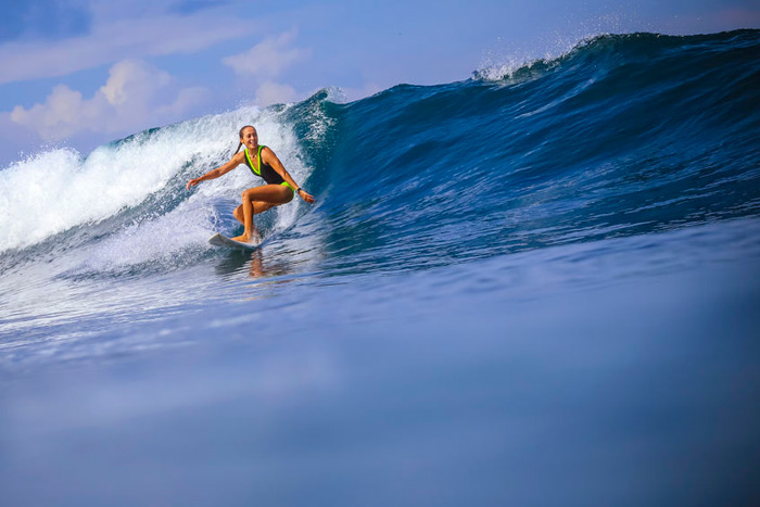 Female surfer riding a wave