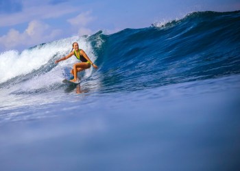 Female surfer riding a wave