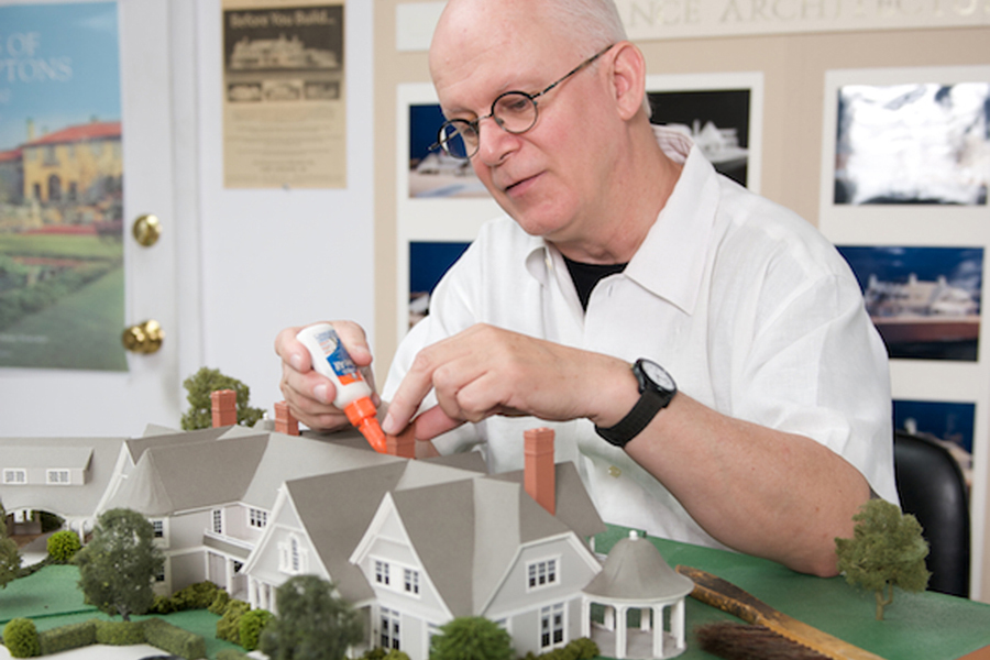 Gary Lawrance works on an architectural model.