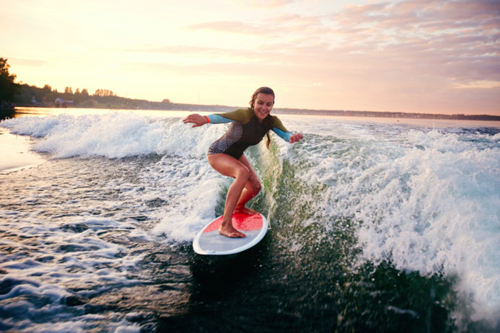 girl surfing tiny wave