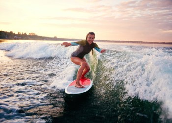 girl surfing tiny wave