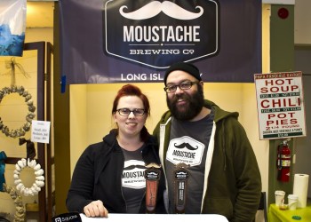 Lauri and Matt Spitz serve Moustache Brewing Co. beer at the Riverhead Farmers Market.