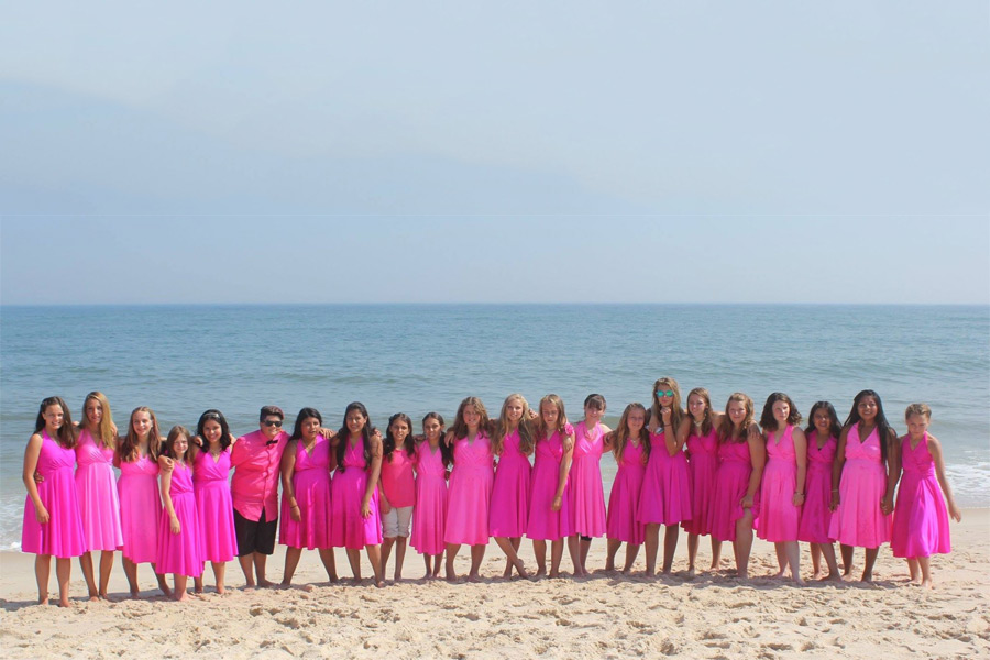 The i-tri Grils celebrate at Coopers Beach