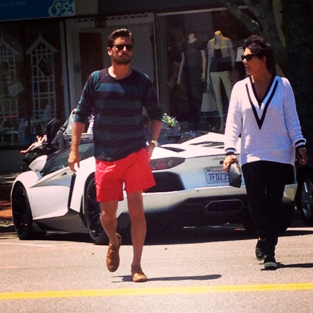 Scott Disick and Kris Jenner cross Southampton Village Main Street after parking The Lord's Lambo,