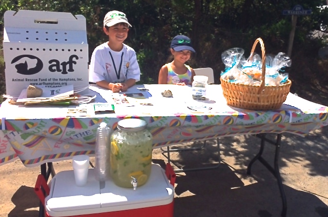 Adam and Eliza Liebowitz sell lemonade and lemon scented potpourri seashells at their Lemonarf Stand in Amagansett.